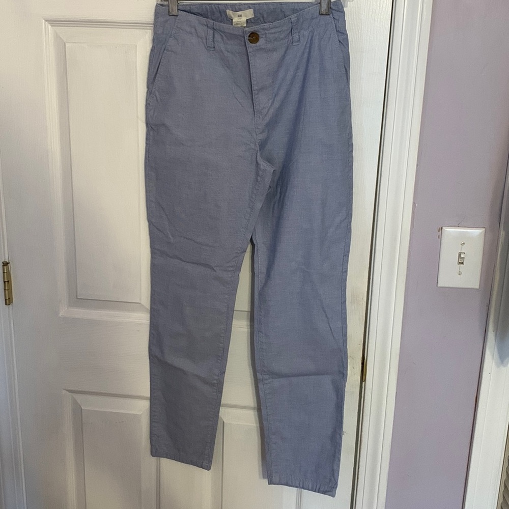 Blue pants. With white stripes. Can be worn rolled up for spring look